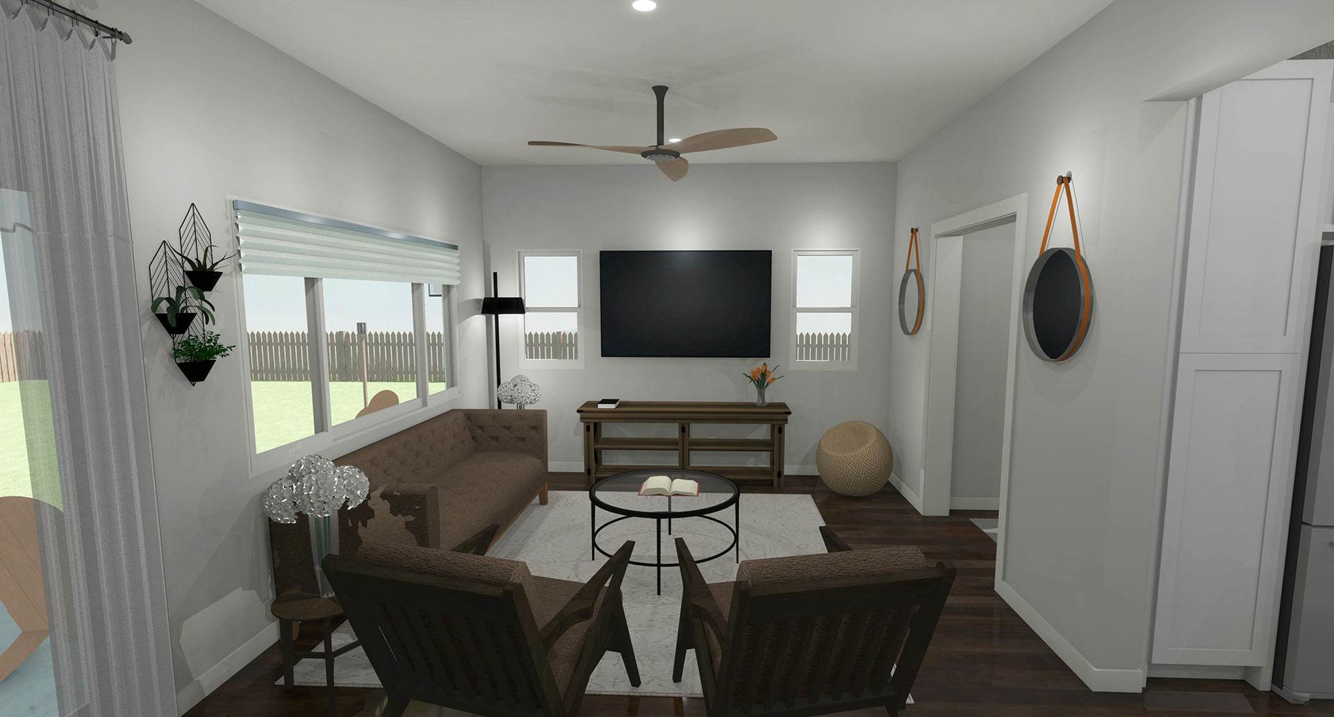 living room with a brown sofa, two brown chairs, and a flat screen TV